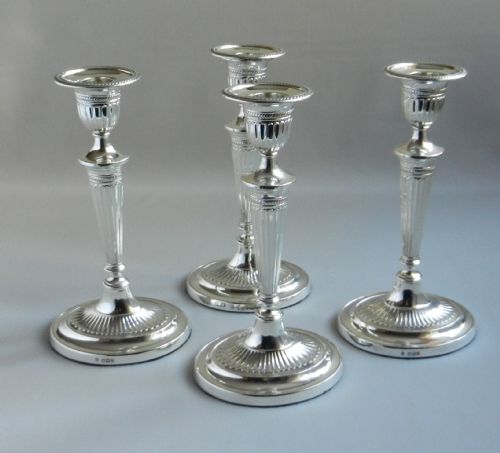set of four antique silver candlesticks