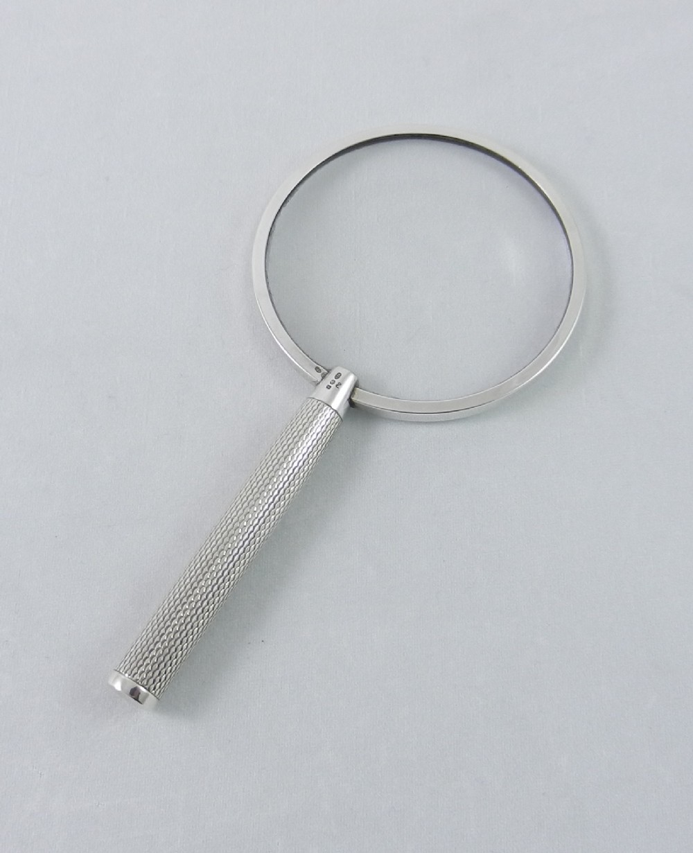 silver magnifying glass
