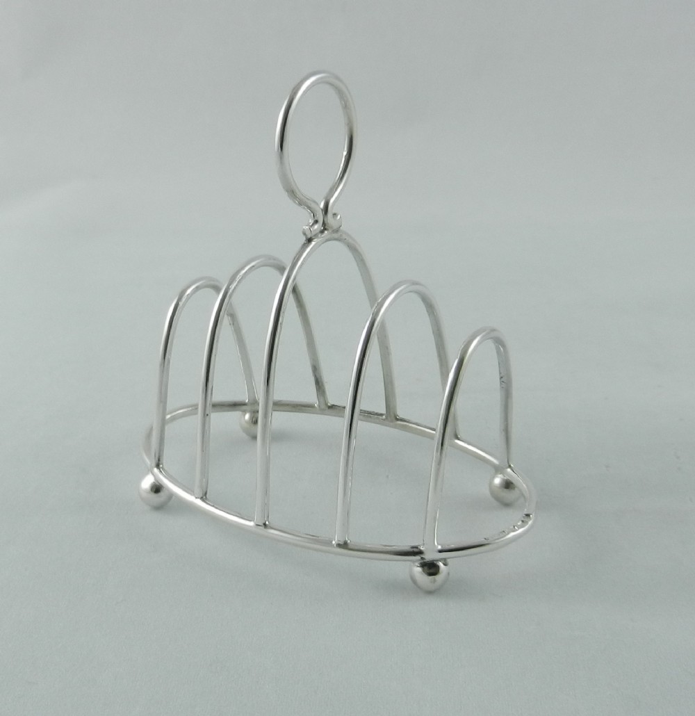 dainty antique silver toast rack