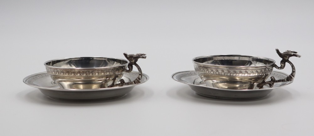 pair of silver cups saucers